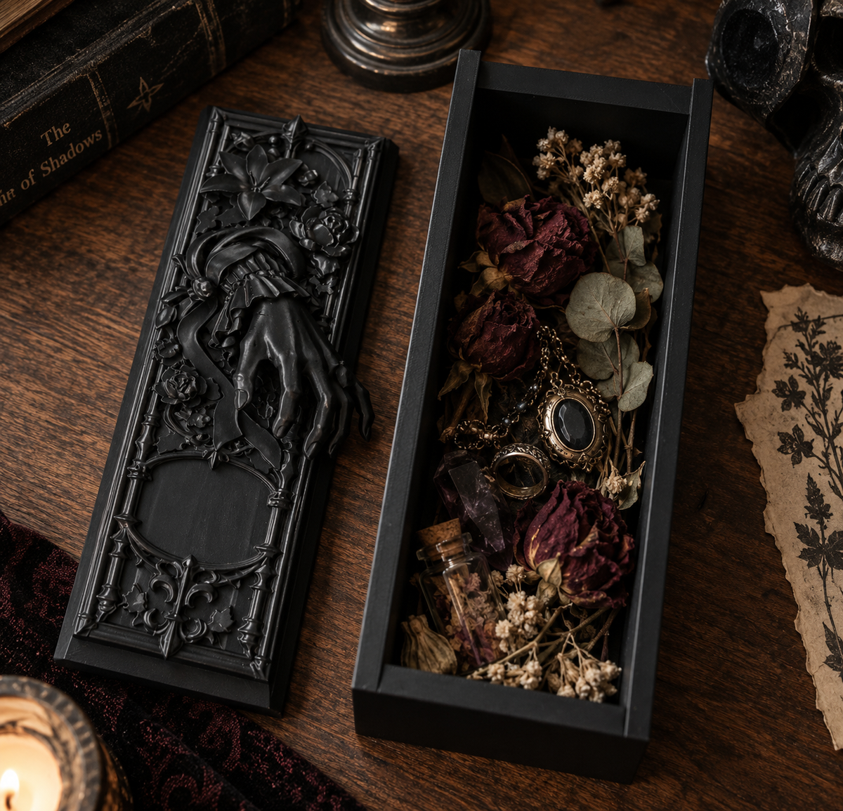 Open Victorian gothic curiosity box filled with dried flowers, jewellery and small curiosities