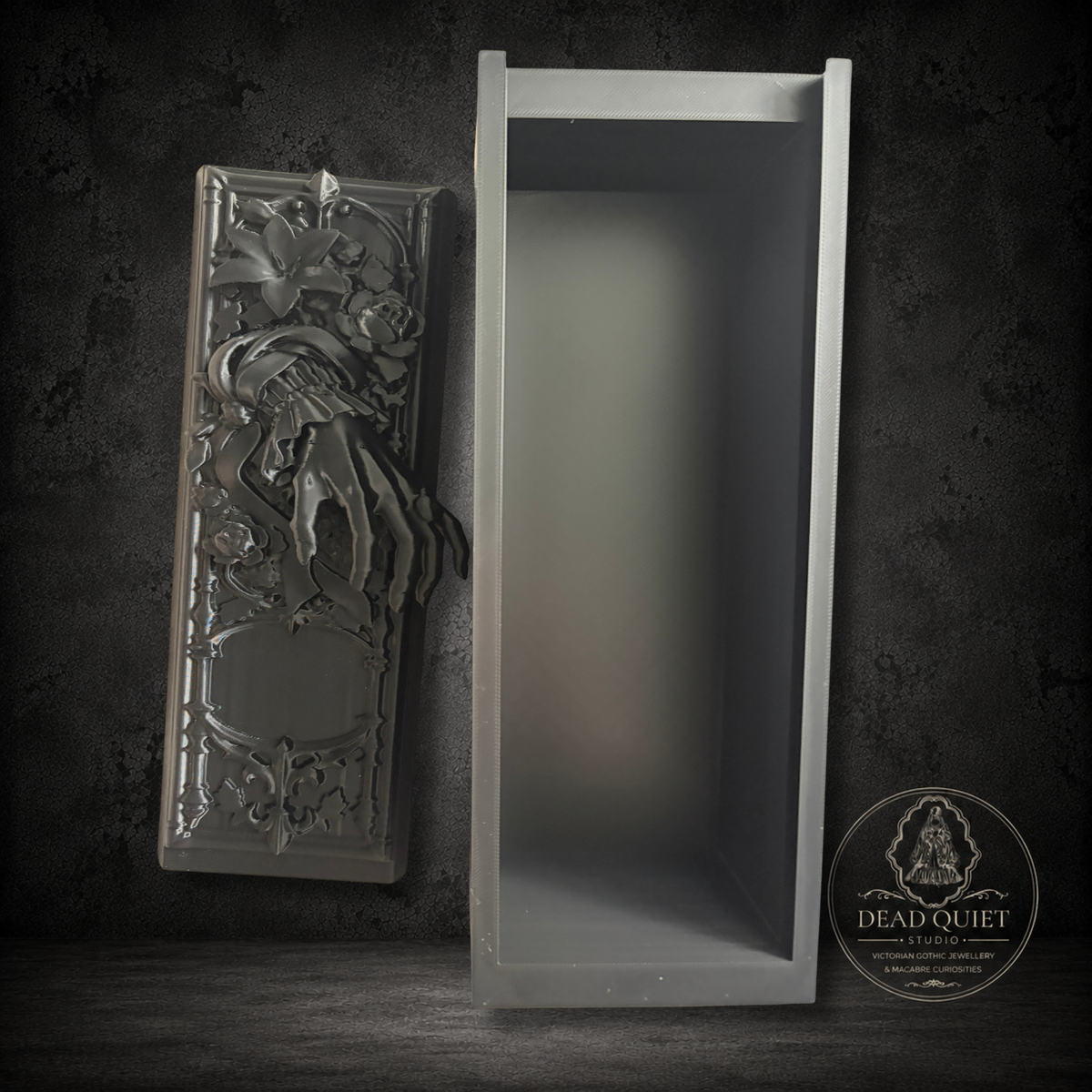 Close up of ornate Victorian mourning book nook with gothic floral and mourning hand relief